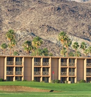 Mountains and a golf course surrounding WorldMark Plaza Resort & Spa, a timeshare resort in Palm Springs, California.