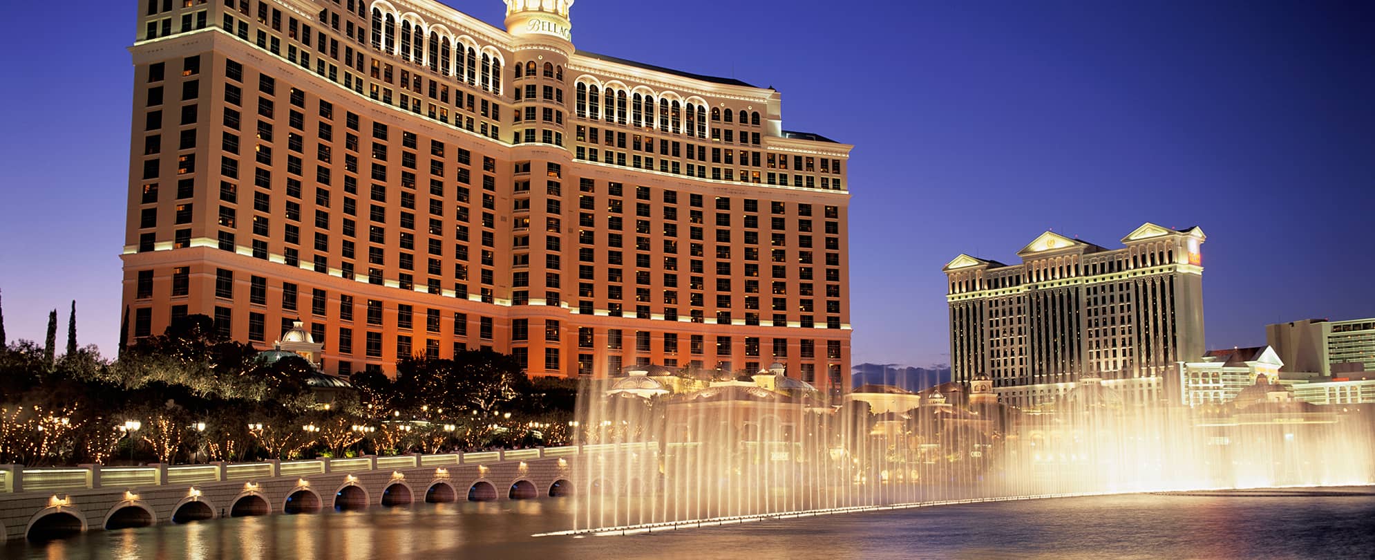The Bellagio Hotel & Casino and fountains lit up at night in Las Vegas, Nevada.