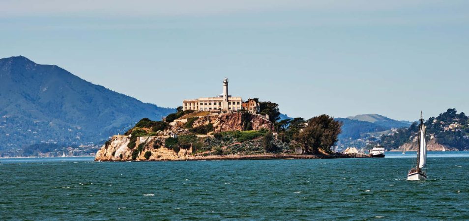 Alcatraz Island surrounded by water off the coast of San Francisco, California.