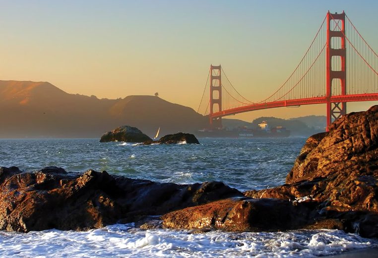 Rocks in the water in front of the Golden Gate Bridge in San Francisco, California