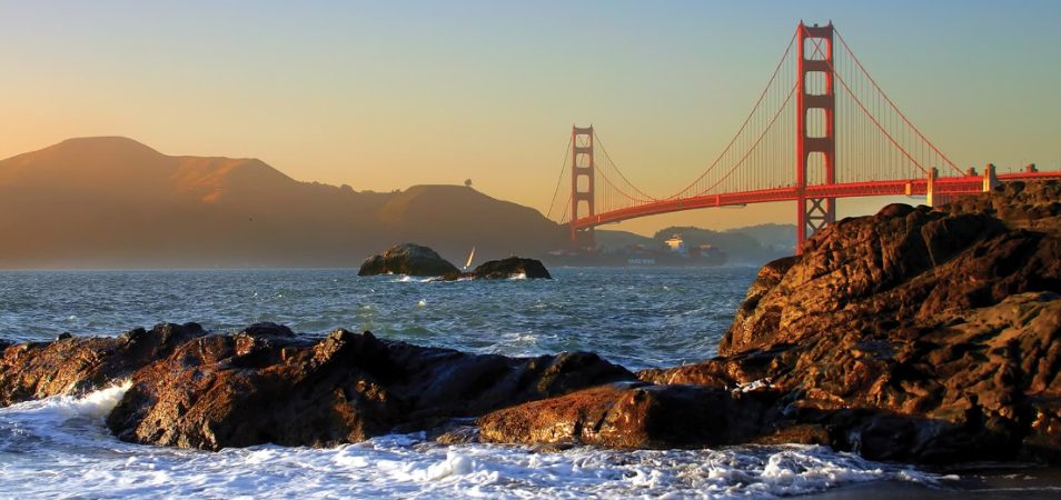 Rocks in the water in front of the Golden Gate Bridge in San Francisco, California