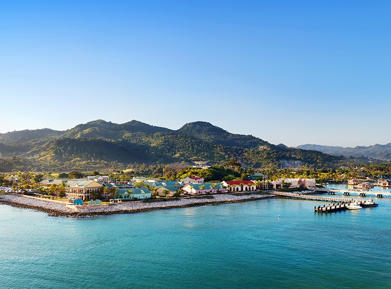 Buildings and a cruise port with mountains in the distance in the eastern Caribbean.