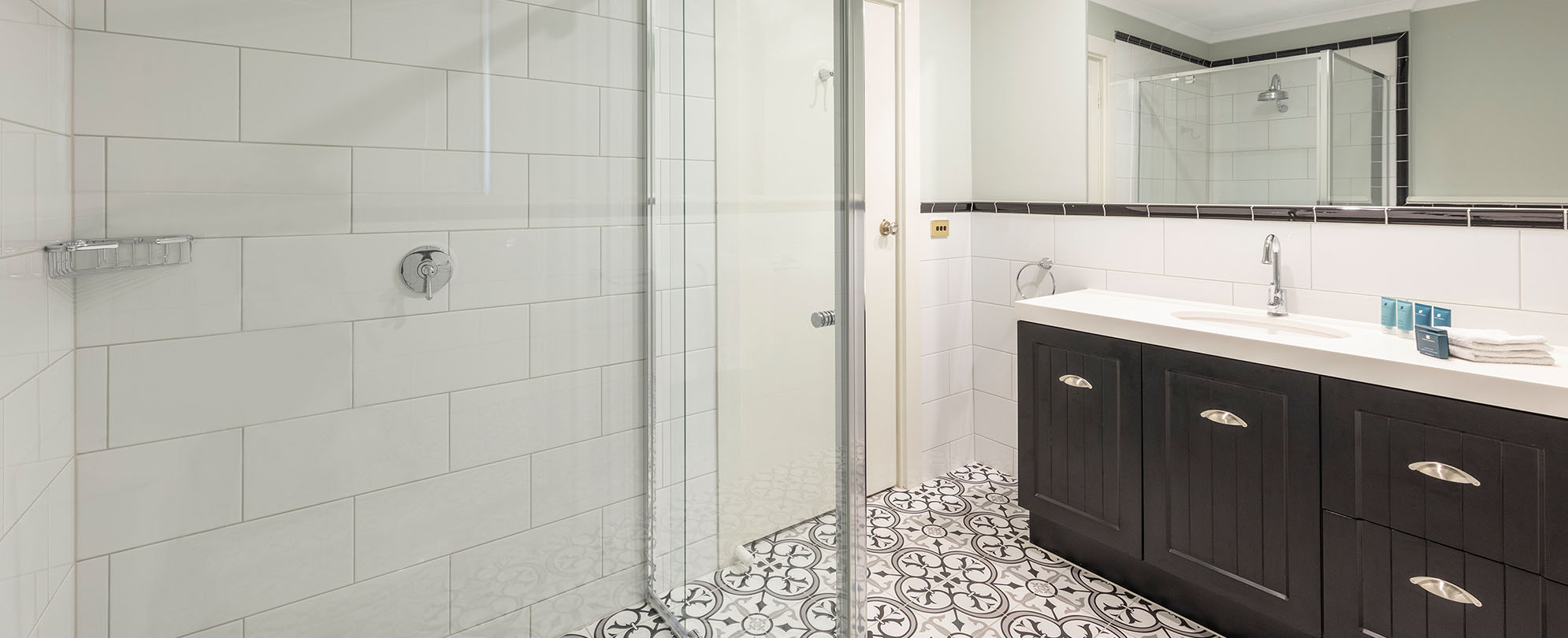 A walk-in shower and bathroom vanity inside a suite at Club Wyndham Ballarat