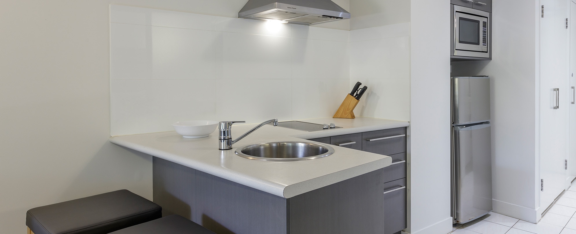 The kitchen of a 1-bedroom suite at Club Wyndham Coffs Harbor.
