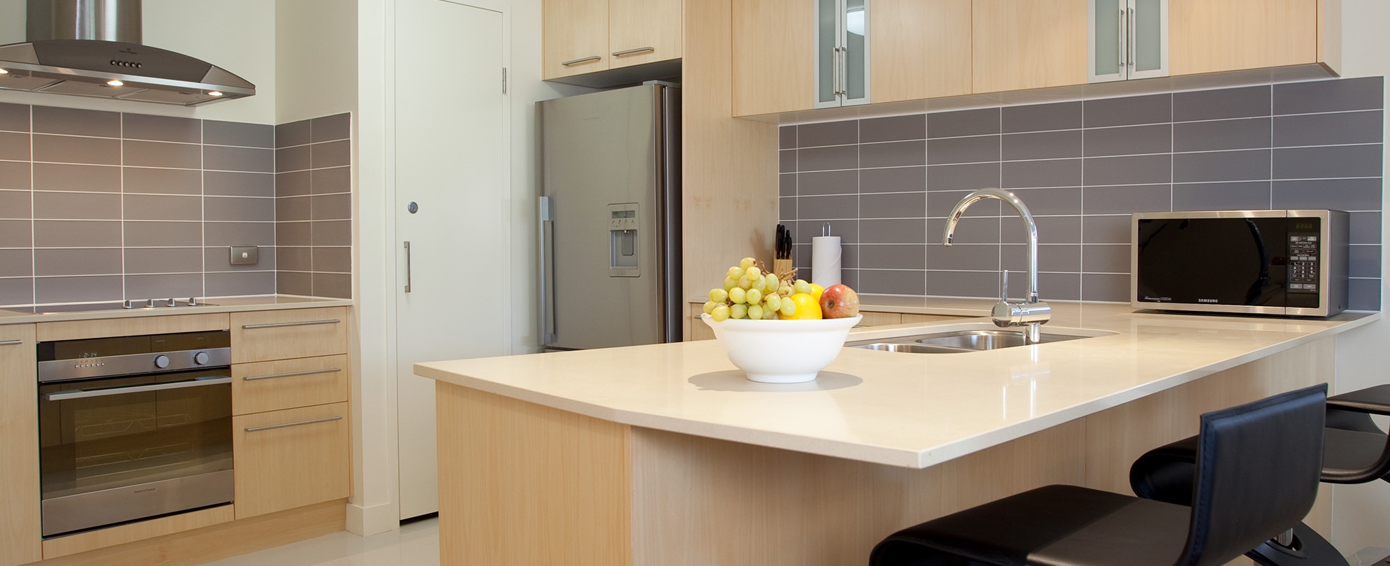 The kitchen of a 2-bedroom deluxe suite at Club Wyndham Coffs Harbor.