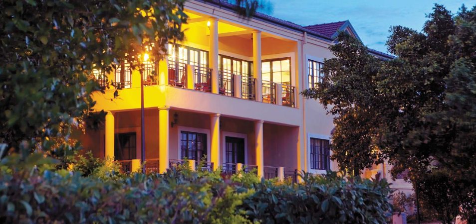 The outside of the Club Wyndham Port Stephens balconies lit up at night.