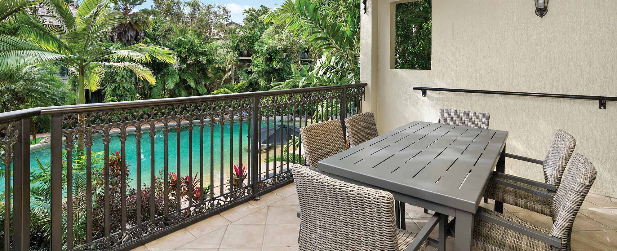 A table for 6, outside on a suite balcony, at WorldMark South Pacific Club by Wyndham Cairns. 