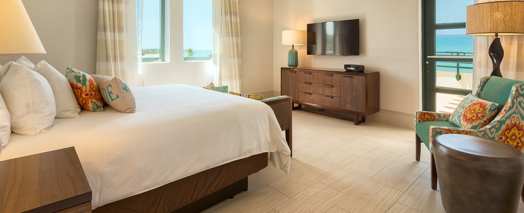 Large bedroom with an ocean view in a Presidential Reserve suite at Margaritaville Vacation Club resort in Rio Mar.