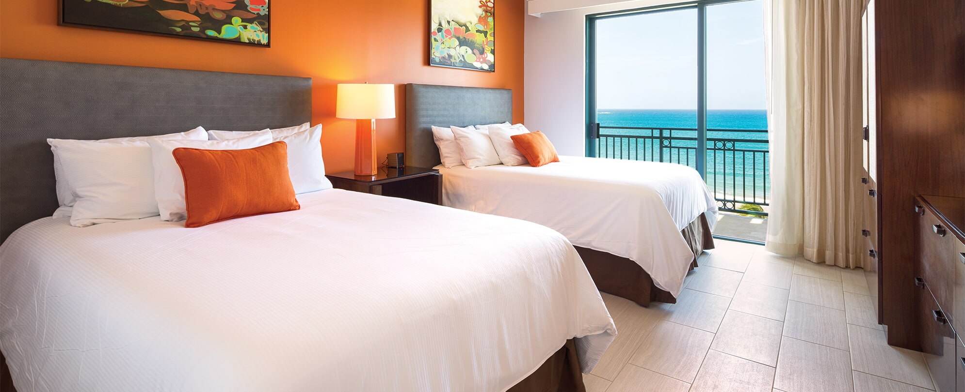 Double beds in a room with ocean view in a Presidential Reserve suite at Margaritaville Vacation Club resort in Rio Mar.