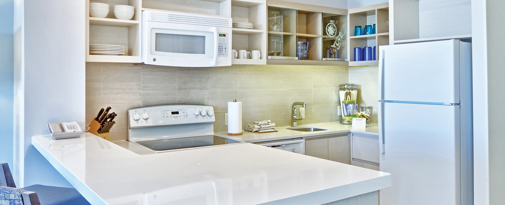 White appliances and countertops in the kitchen of a resort suite at Margaritaville Vacation Club by Wyndham - Rio Mar.
