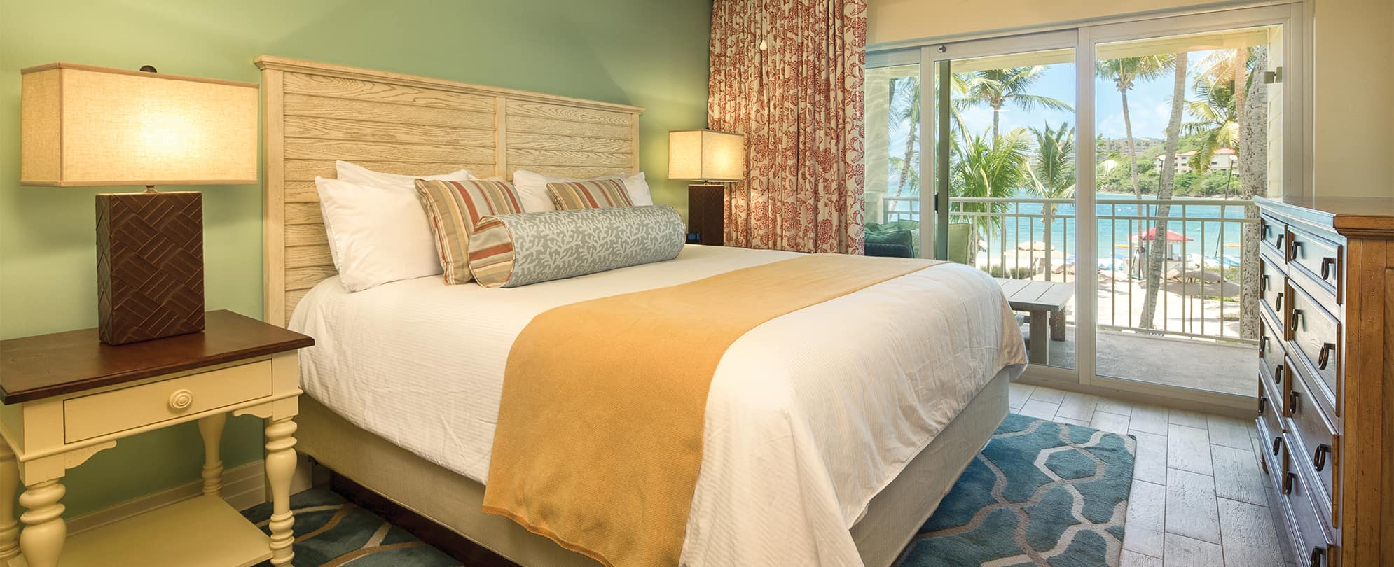 Presidential Reserve bedroom with king bed and ocean view at Margaritaville Vacation Club by Wyndham - St. Thomas.