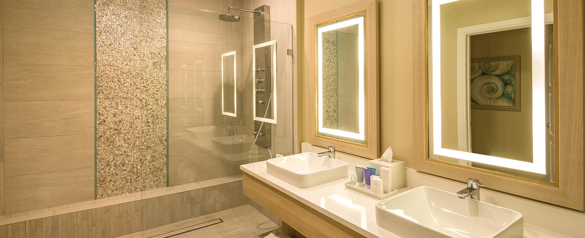 Double sinks and large glass shower in a Presidential Reserve suite at Margaritaville Vacation Club by Wyndham - St. Thomas.