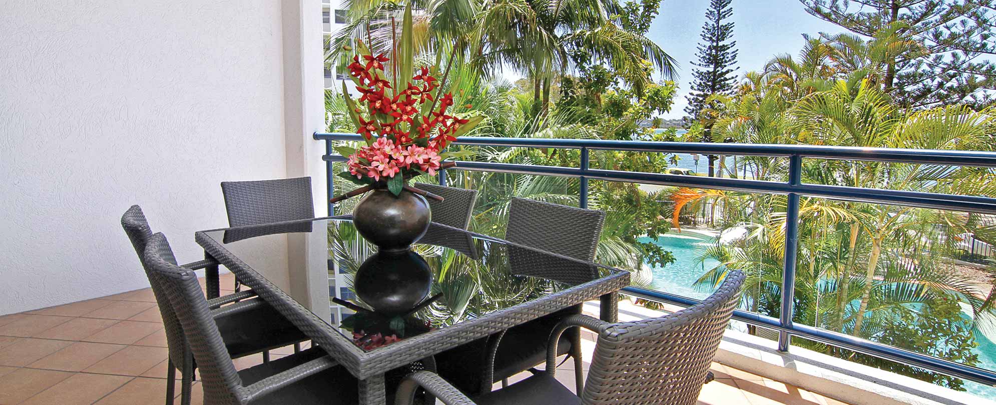 A table with chairs on the balcony of a 1-bedroom suite at Club Wyndham Golden Beach.
