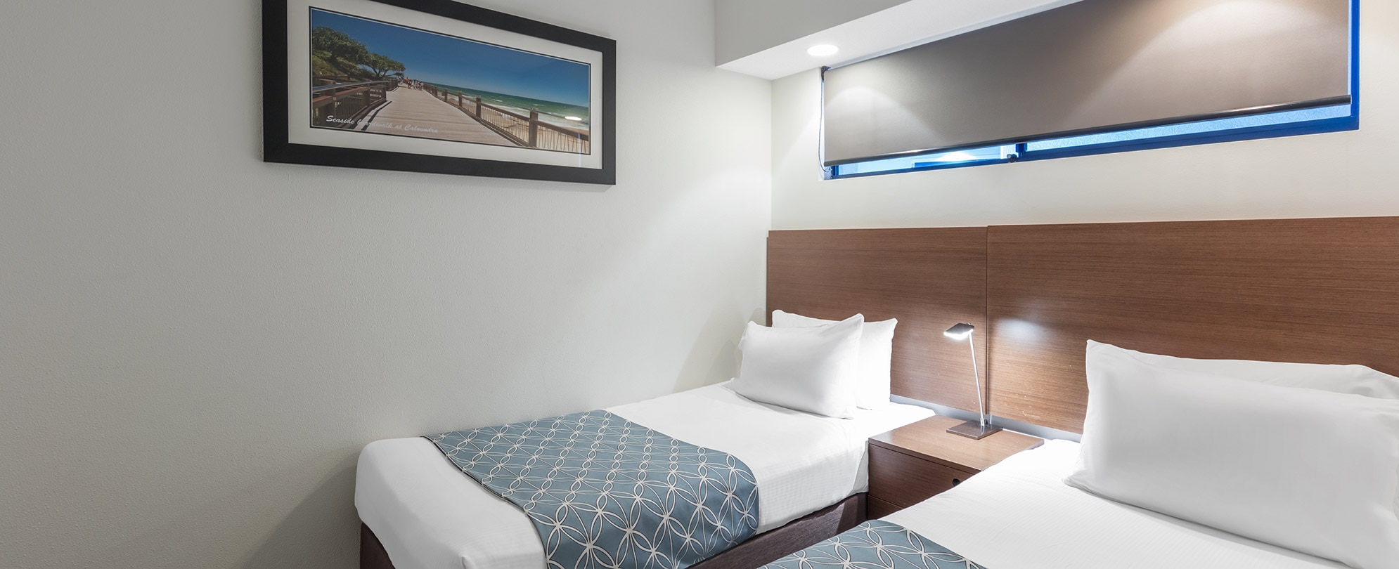 Two twin beds in one of the bedrooms of a 2-bedroom suite at Club Wyndham Golden Beach. 