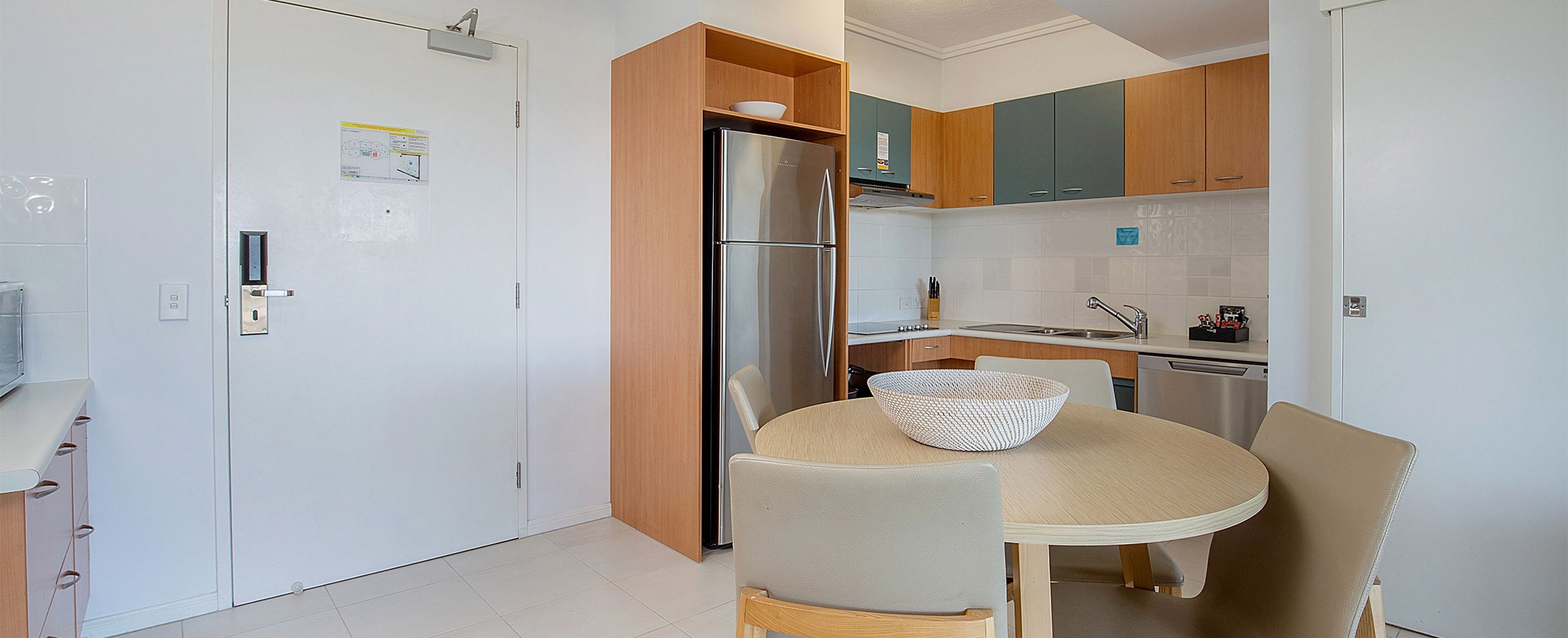 The kitchen and dining area of a handicap accessible suite at Club Wyndham Kirra Beach.