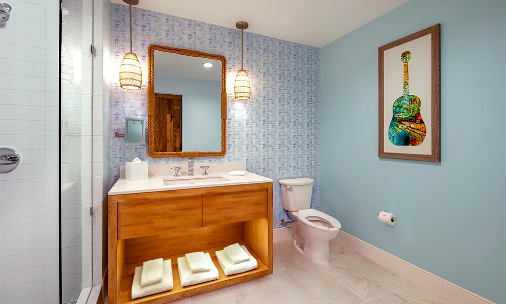 A Margaritaville Vacation Club Studio suite sink, toilet, and walk-in shower at the Nashville, TN resort. 