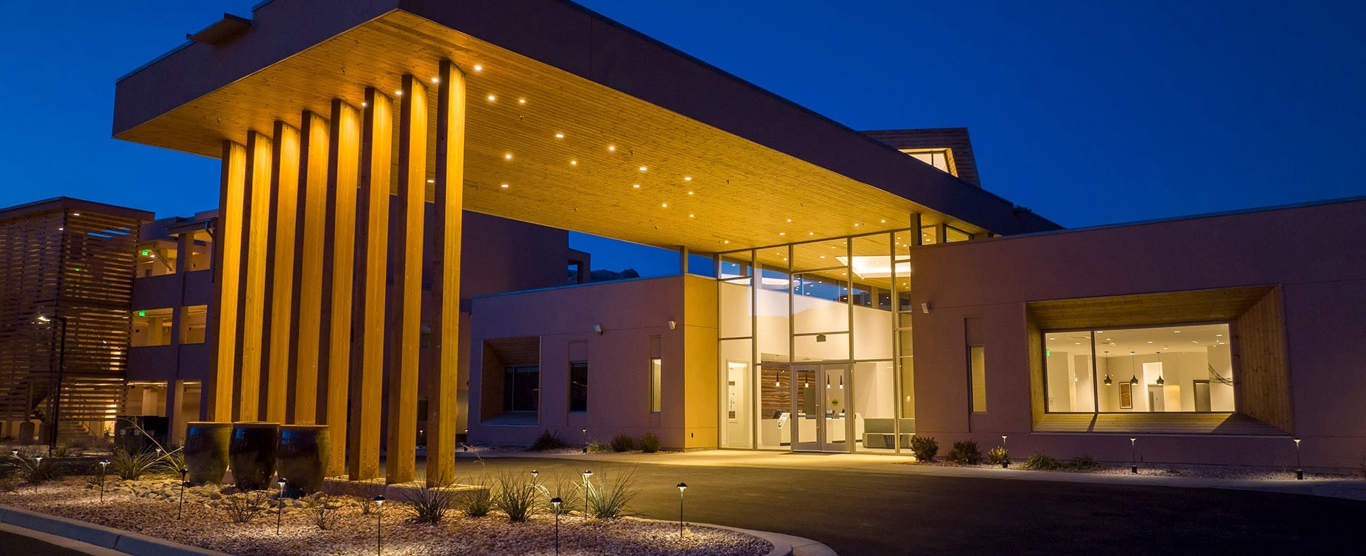 The exterior entrance to WorldMark Moab with bright lights at night.