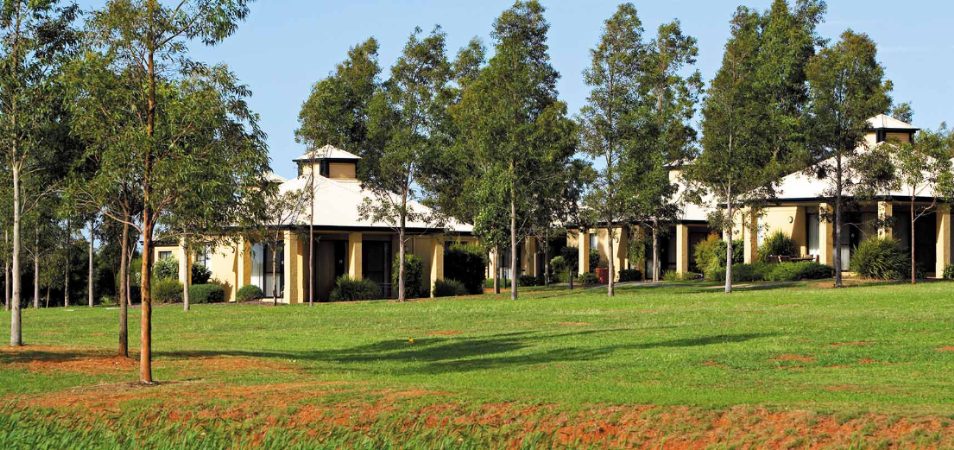 A tree-lined field in front of Club Wyndham Polkolbin Hill, a timeshare resort in New South Wales, Australia.