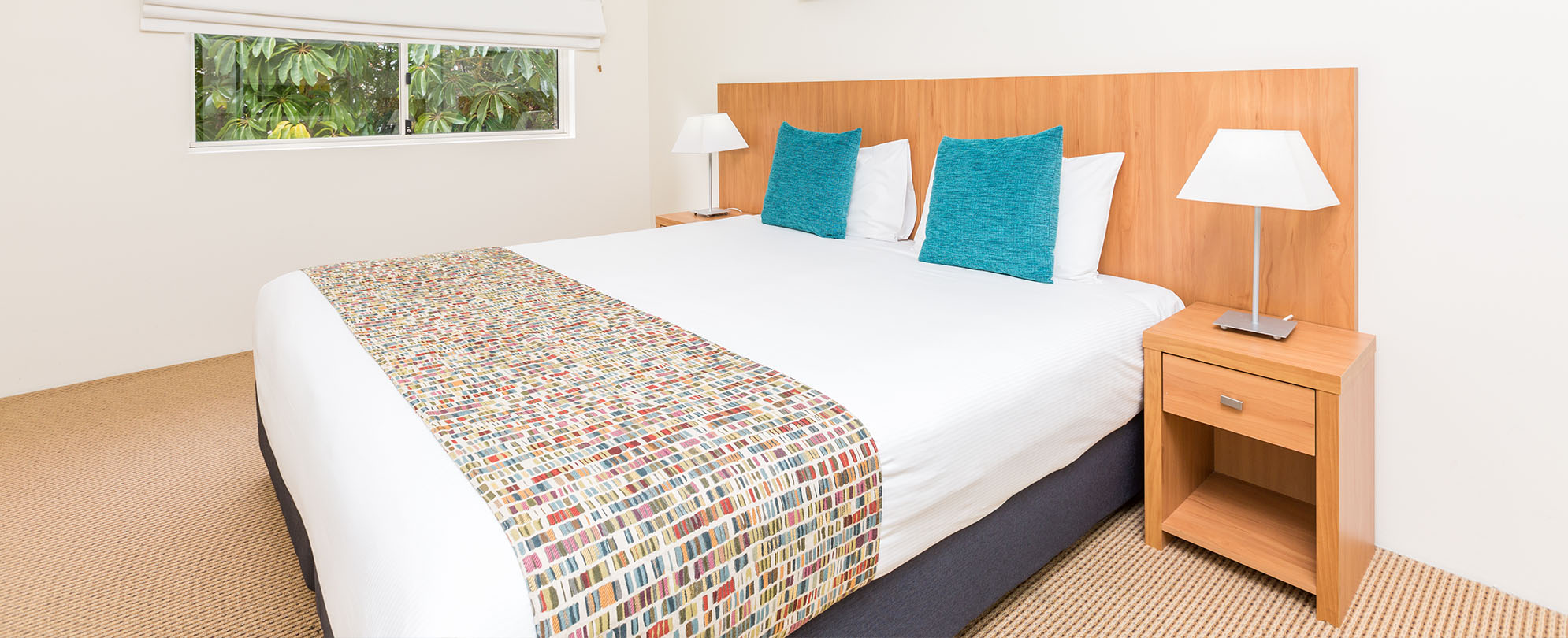 A  king-sized bed in a studio suite at Club Wyndham Shoal Bay.