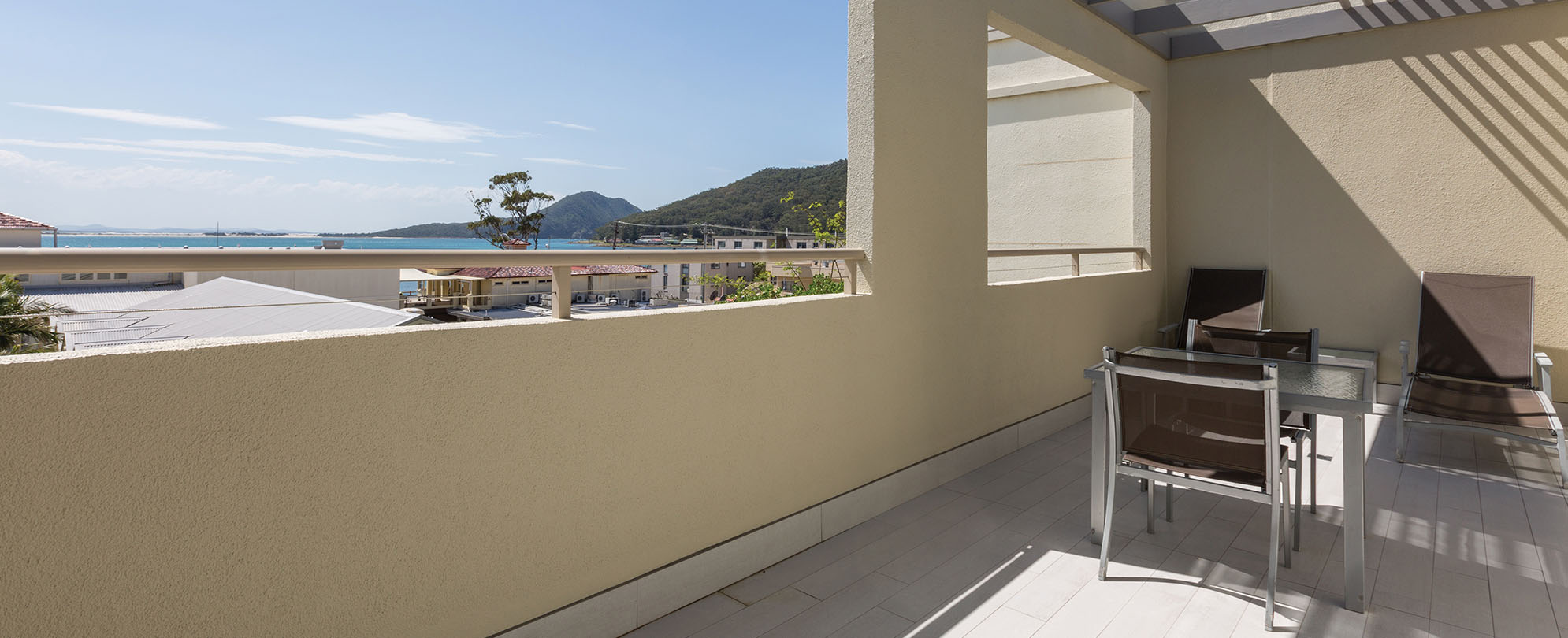 A balcony with a view from a 2-bedroom deluxe suite at Club Wyndham Shoal Bay.