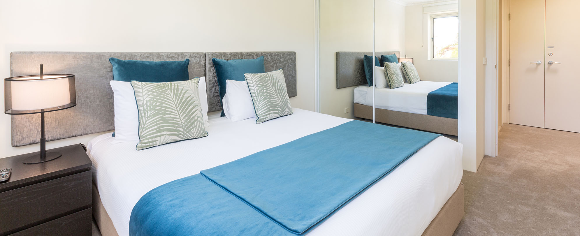 A king-sized bed in a 2-bedroom presidential reserve suite at Club Wyndham Shoal Bay.