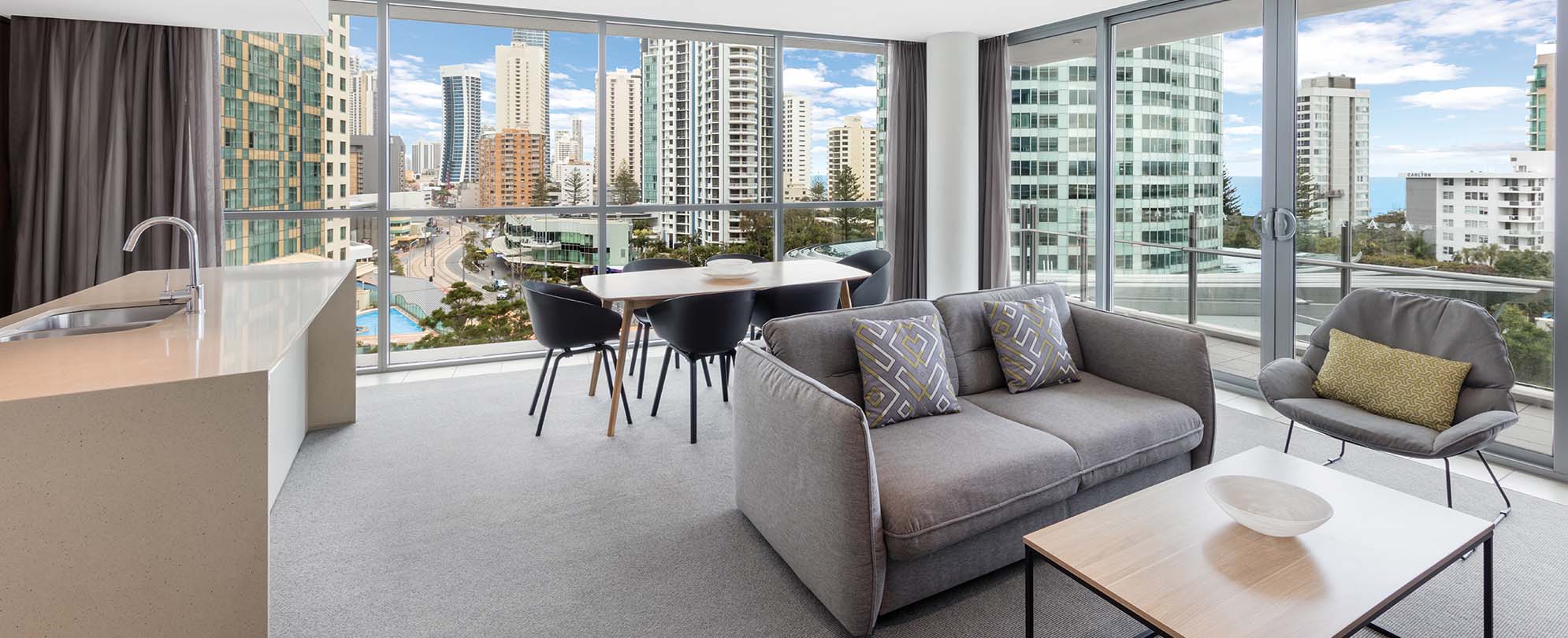 The dining and living area of a 2-bedroom suite at Club Wyndham Surfers Paradise.