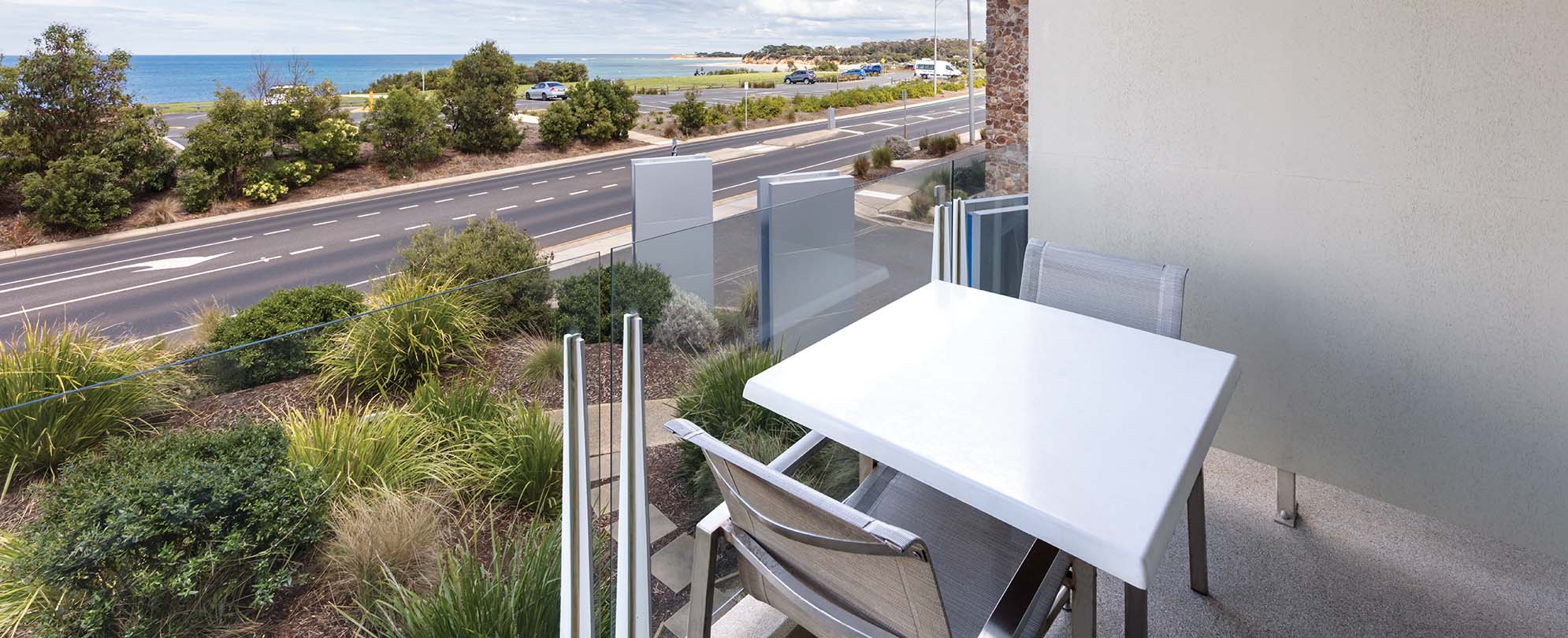A Club Wyndham Torquay studio suite balcony with a table and chairs. 