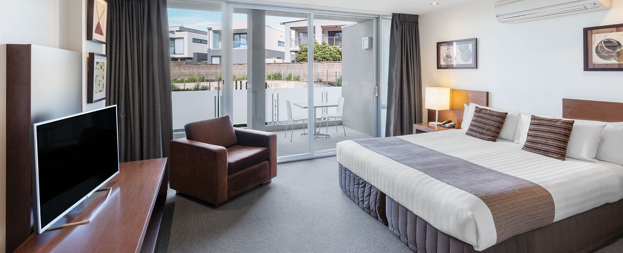The master bedroom, inside a 1-bedroom accessible suite at Club  Club Wyndham Torquay.Wyndham 