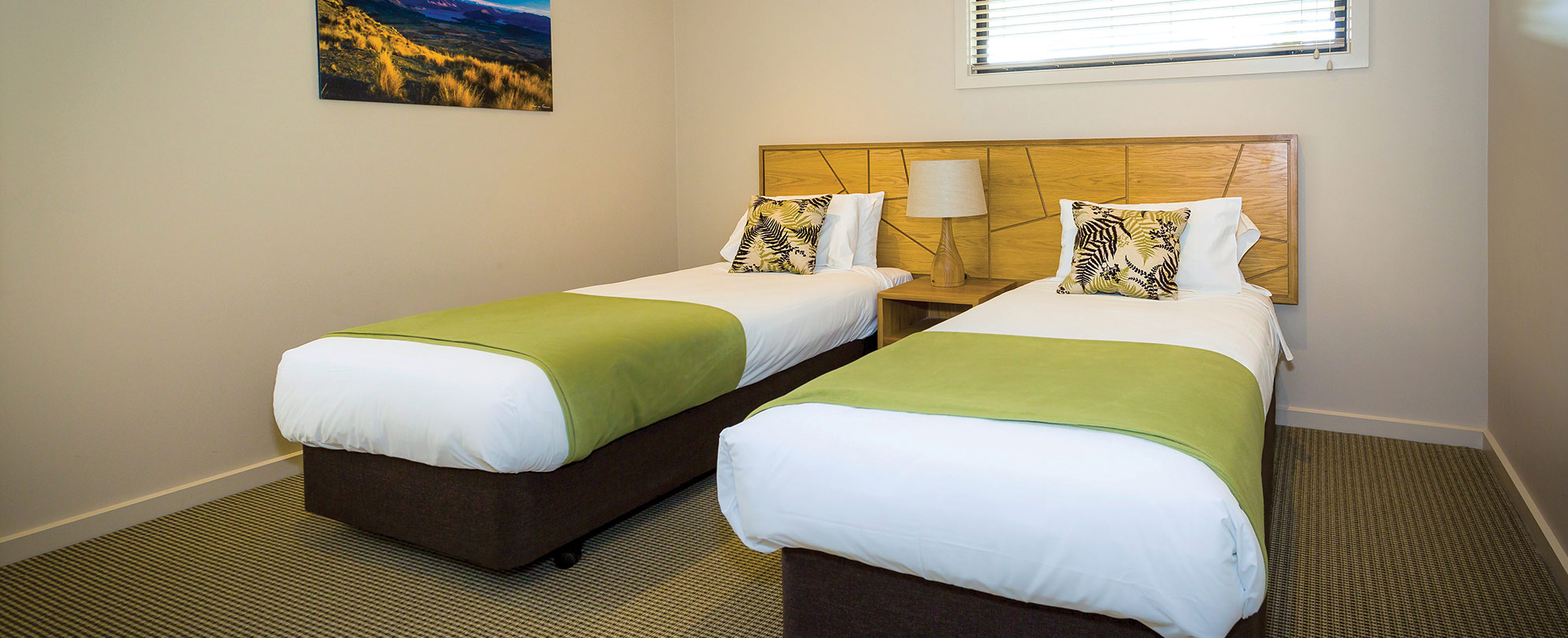 Two twin-sized beds in the third room of the 3-bedroom suite at Club Wyndham Wanaka.