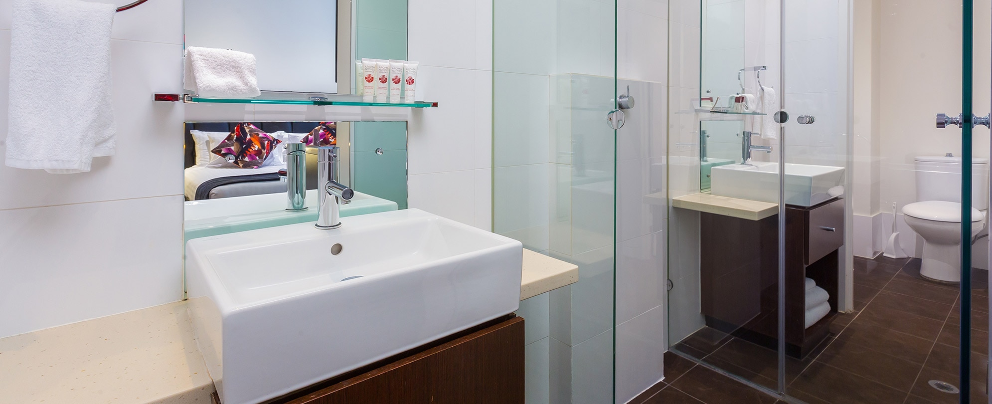 A toilet and sink inside a studio suite at Club Wyndham Perth