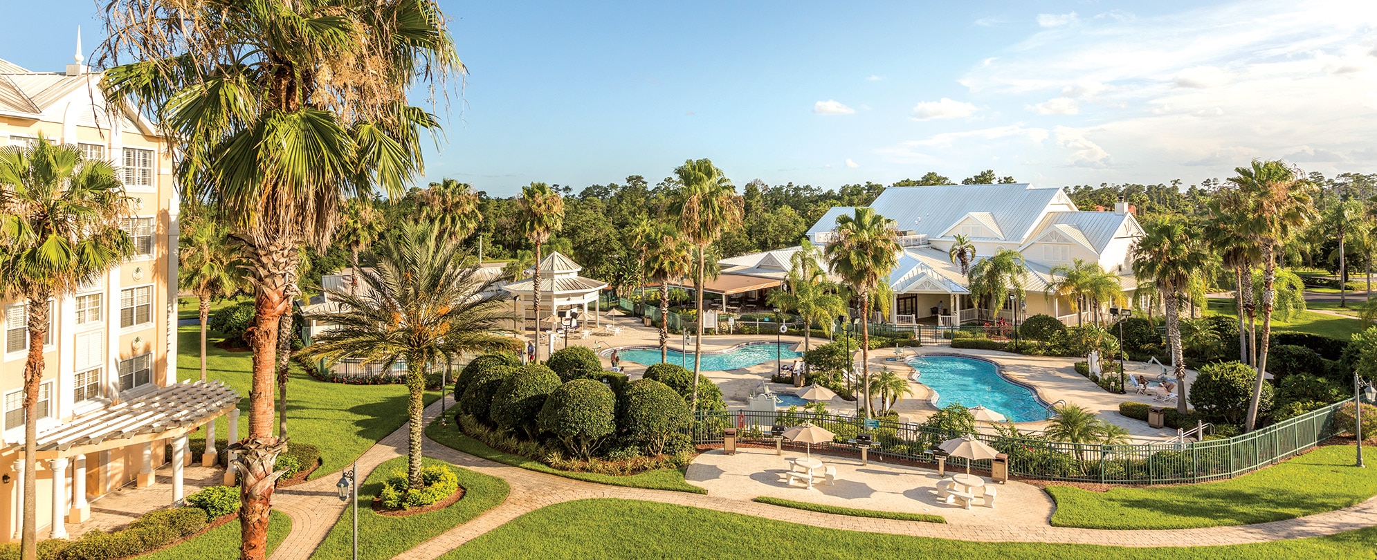 The outdoor pools and exterior of WorldMark Kingstown Reef, a Key West-style timeshare resort in Orlando, Florida.