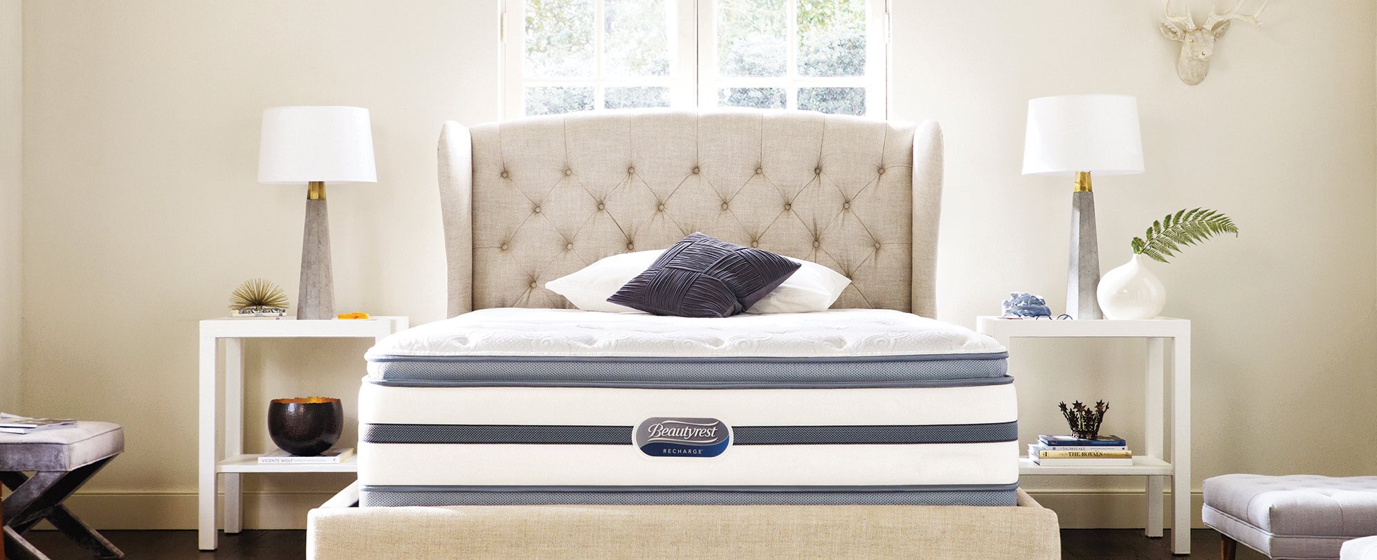 A Beautyrest mattress on an upholstered bed frame,  sold at WorldMark The Store.