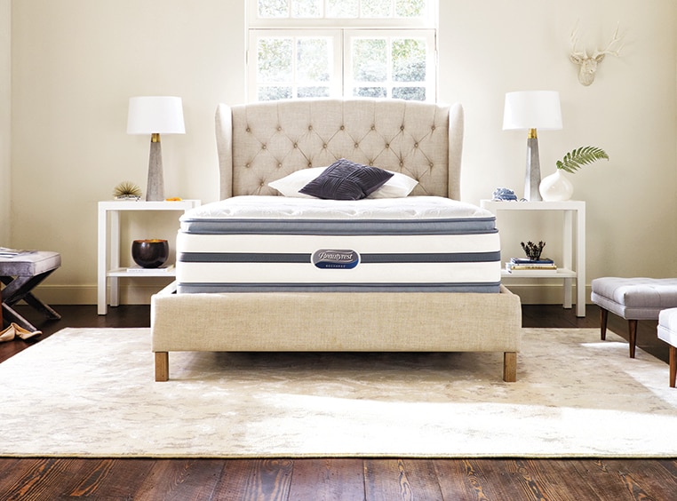 A Beautyrest mattress on an upholstered bed frame,  sold at WorldMark The Store.