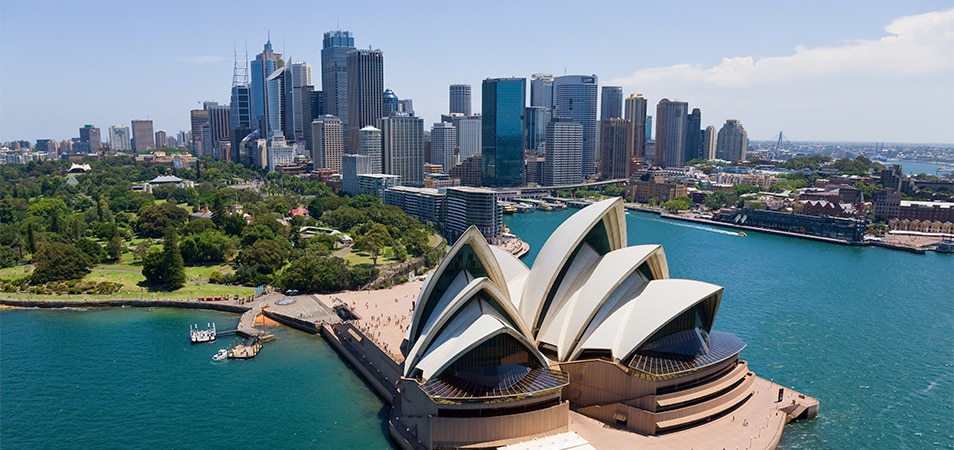 The Sydney Opera House, with the city skyline in the distance.