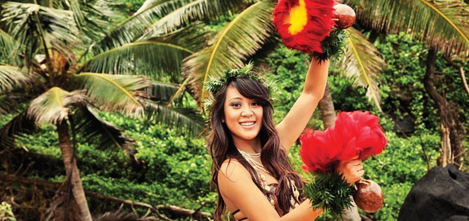 A Hawaiian woman performing a luau. 