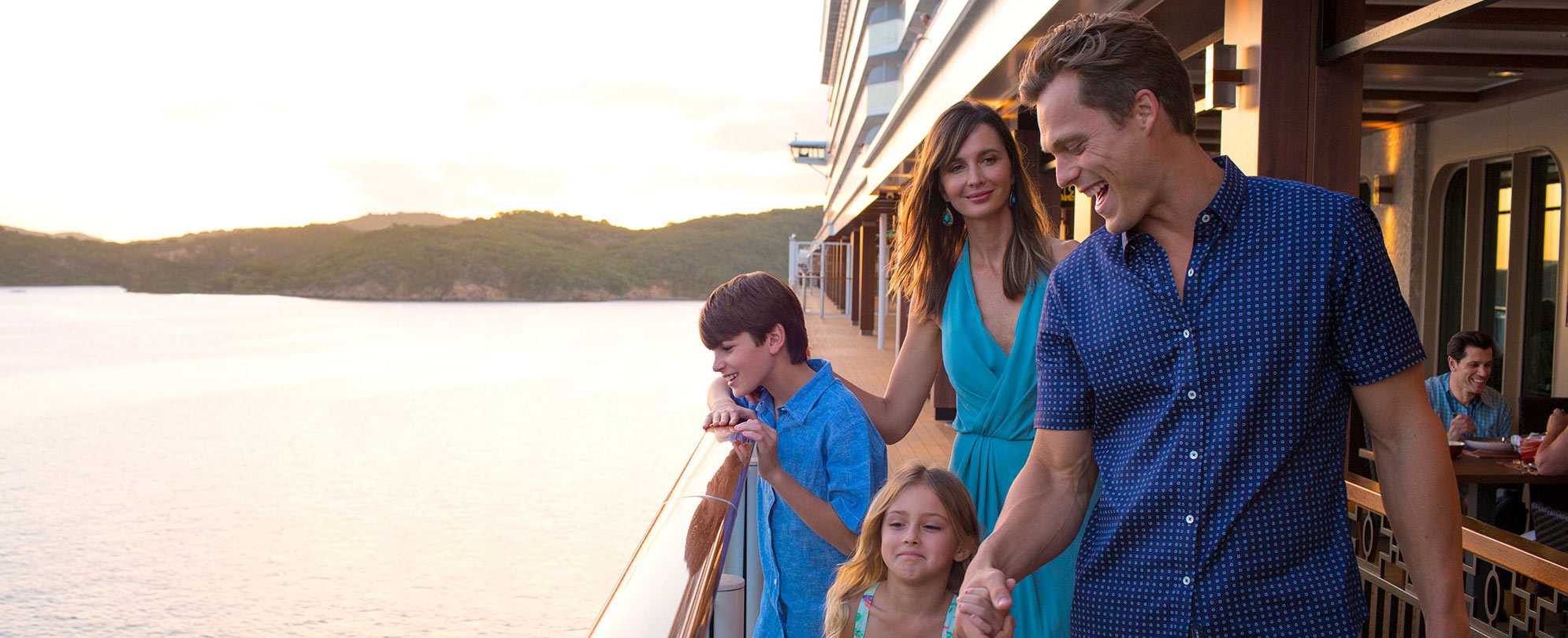 A family of four enjoying their time on a cruise ship.