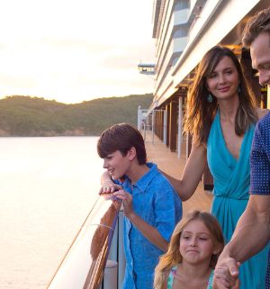 A family of four enjoying their time on a cruise ship.
