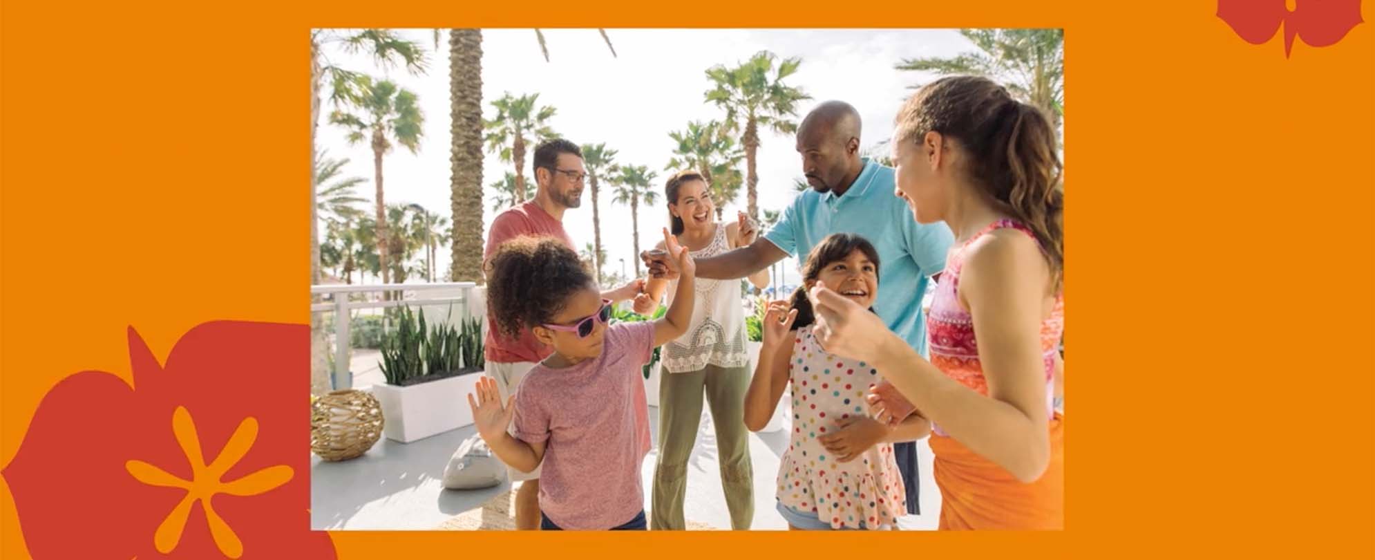 Kids and adults dancing and smiling outside at a WorldMark resort.