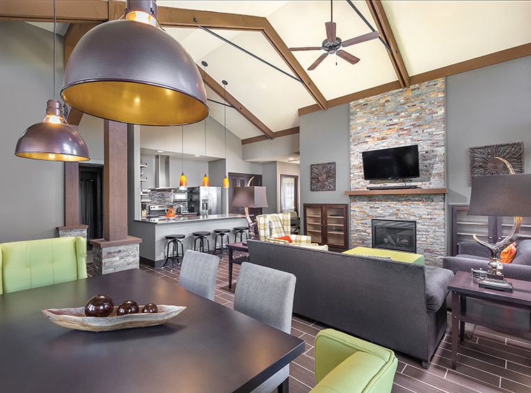 A dining room, living area, and kitchen inside a WorldMark by Wyndham suite.